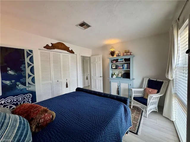 a bedroom with a bed and furniture