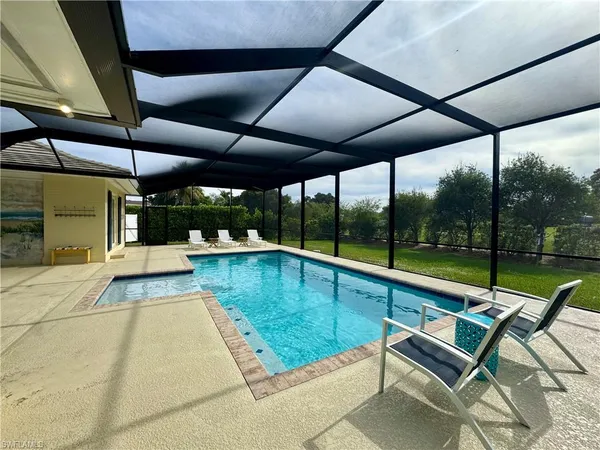 a view of swimming pool with a patio