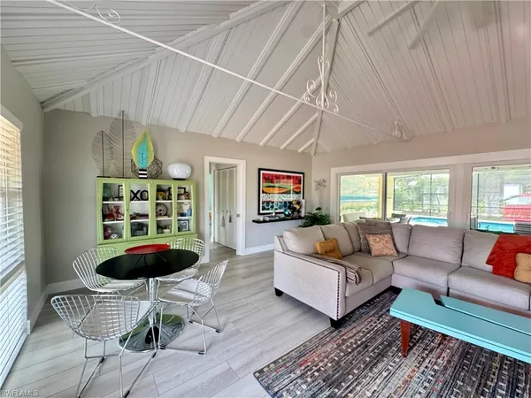 a living room with furniture and a rug