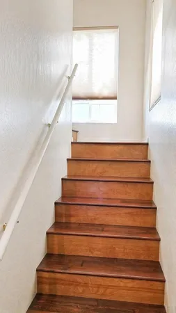a view of an entryway with wooden floor