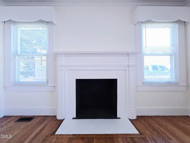 a room with a fireplace and a fireplace