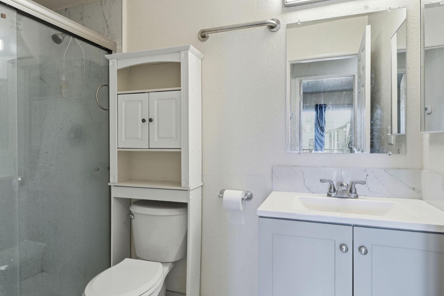 7283 Florin Road, Unit 8 Sacramento, CA 95828 - Photo 25 of 35 a bathroom with a sink a toilet and shower
