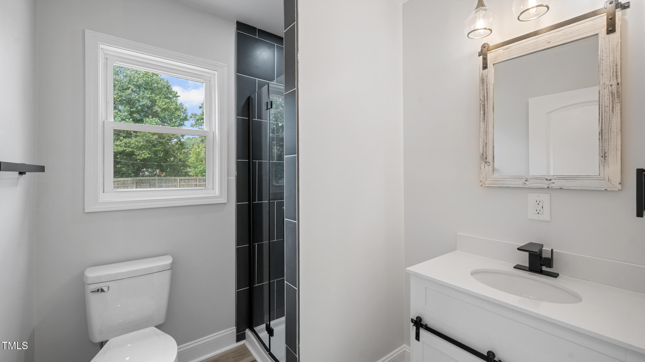 2634 William Allen Road Burlington, NC 27217 - Photo 13 of 37 a bathroom with a toilet sink and mirror