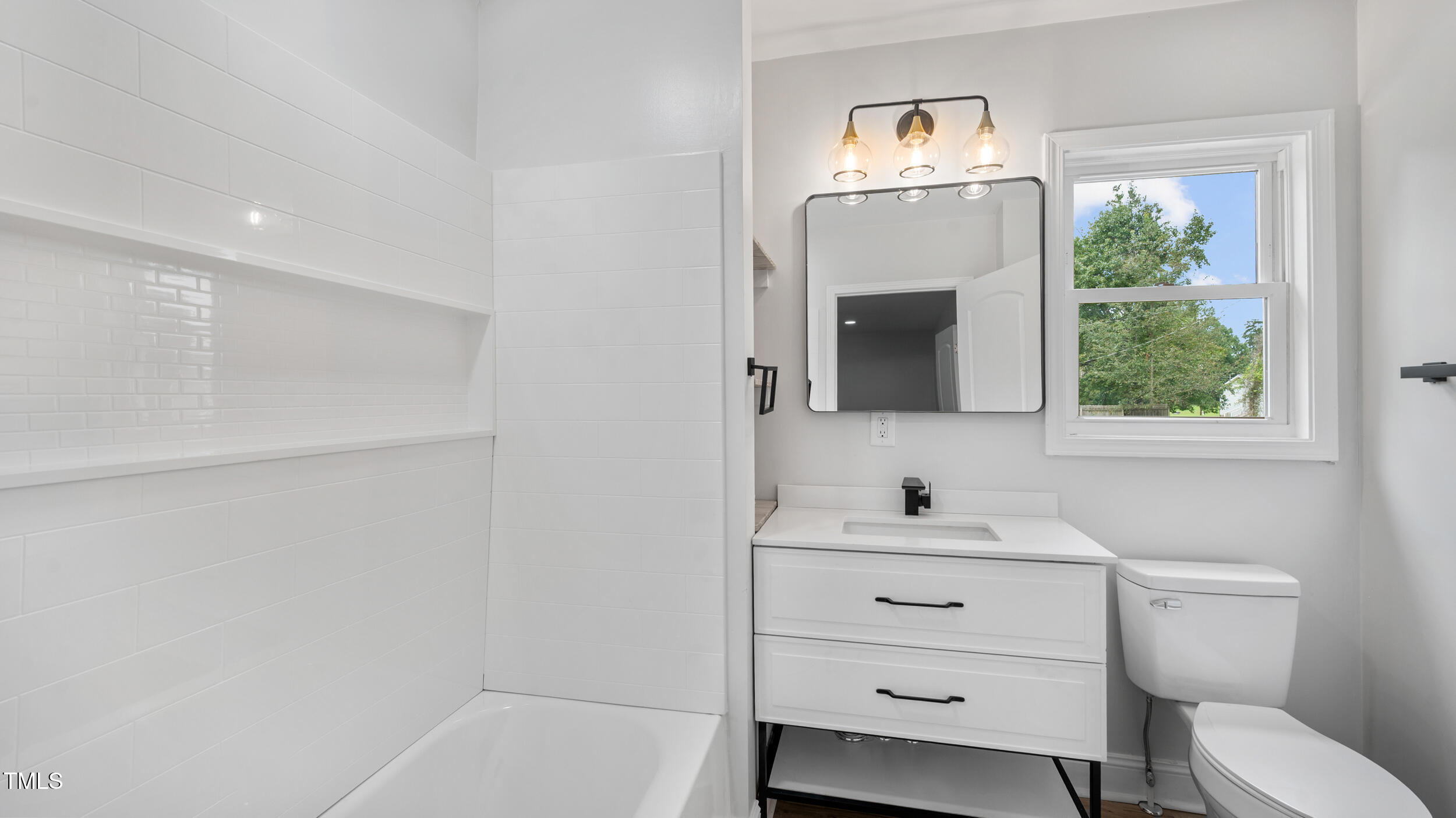 2634 William Allen Road Burlington, NC 27217 - Photo 17 of 37 a bathroom with a sink and a mirror