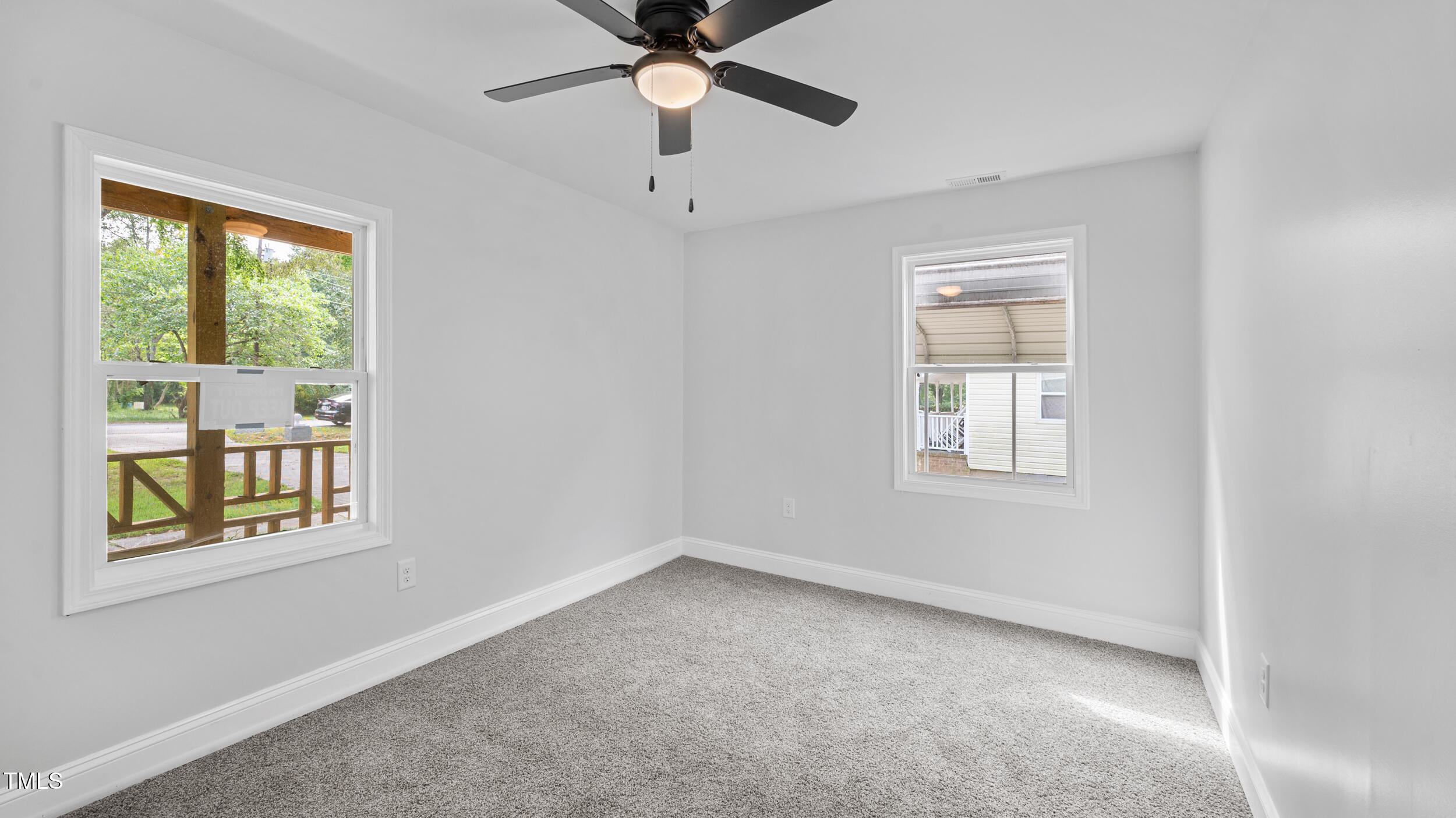 2634 William Allen Road Burlington, NC 27217 - Photo 21 of 37 an empty room with a window and a fan