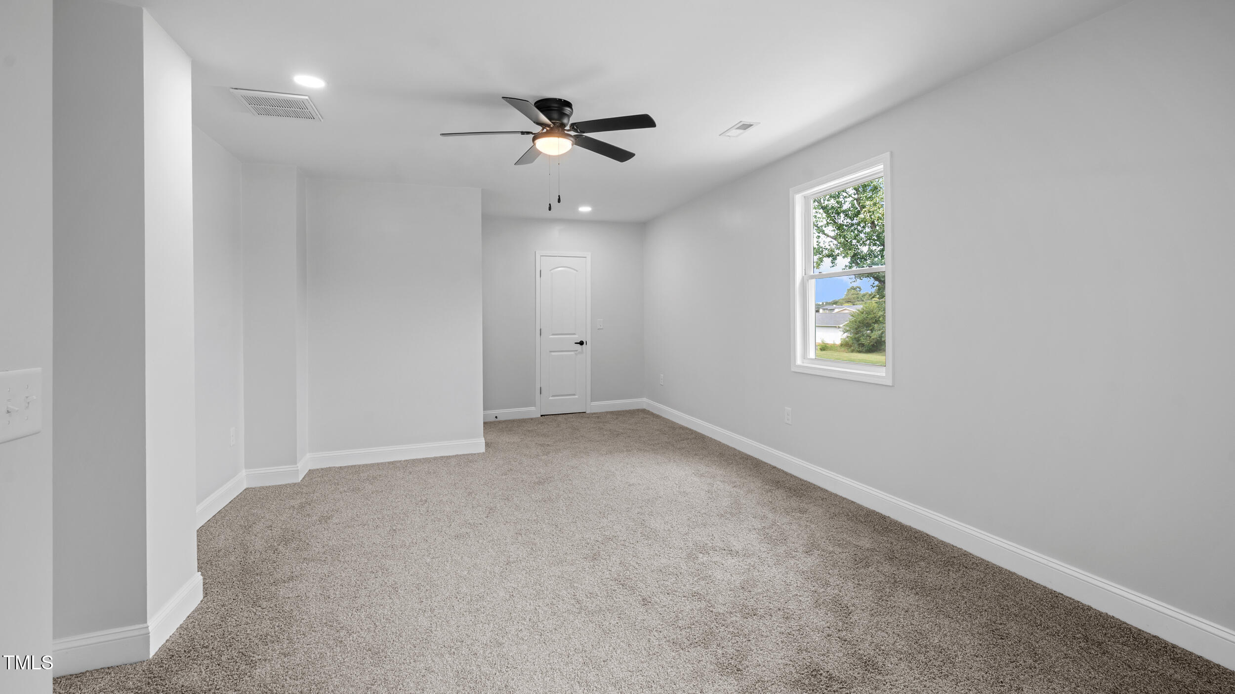 2634 William Allen Road Burlington, NC 27217 - Photo 27 of 37 an empty room with windows and fan