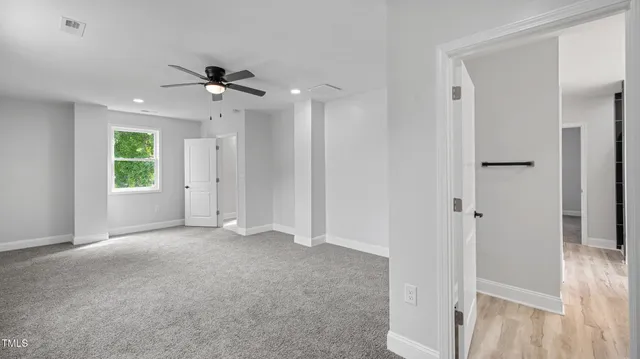 a bathroom with a tub and a window