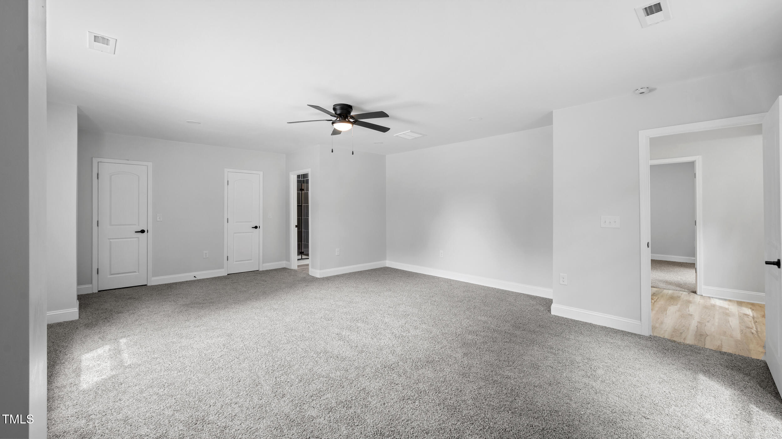 2634 William Allen Road Burlington, NC 27217 - Photo 32 of 37 a view of a big room with chandelier fan and windows