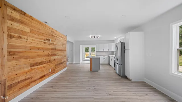 a view of a living room with a wooden floor