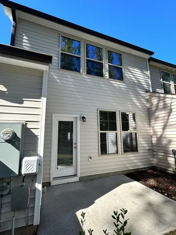 a front view of a house with outdoor space