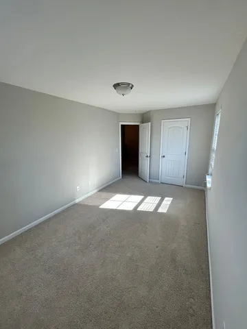 a bathroom with a shower and a sink