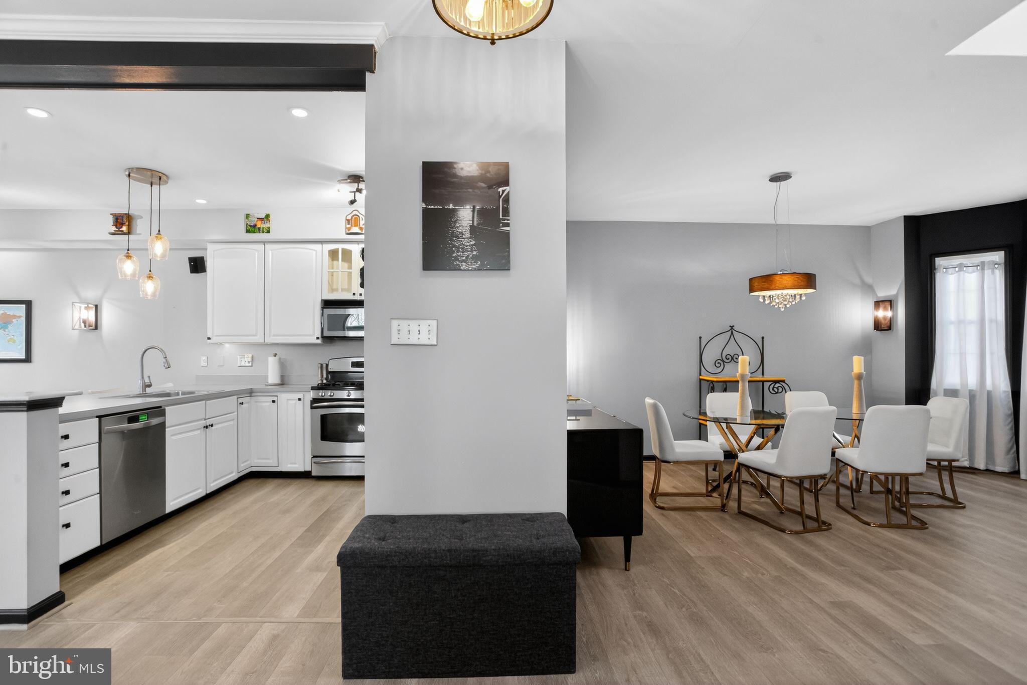201 Victoria Court Ambler, PA 19002 - Photo 12 of 36 a large white kitchen with stainless steel appliances