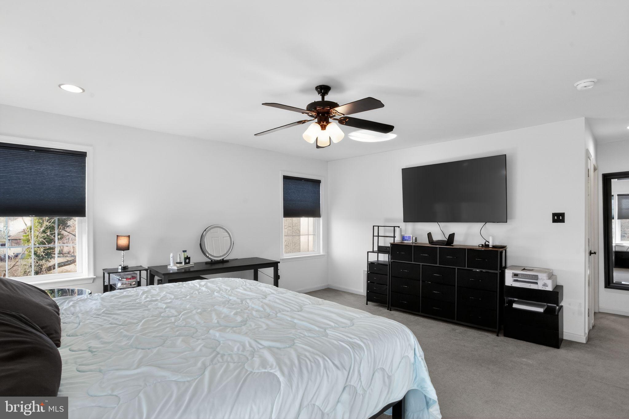 201 Victoria Court Ambler, PA 19002 - Photo 18 of 36 a bedroom with a bed and a flat screen tv