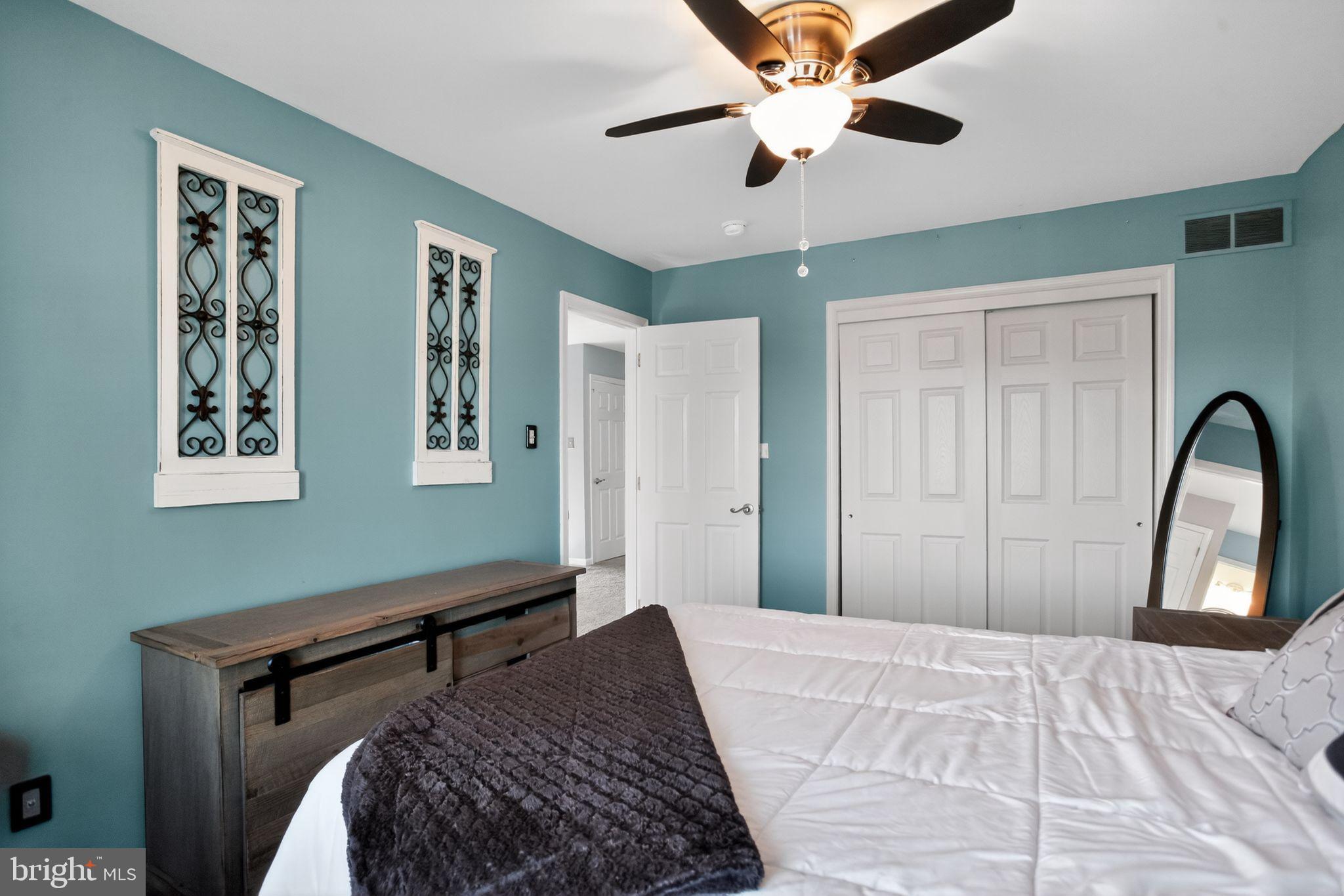 201 Victoria Court Ambler, PA 19002 - Photo 21 of 36 a bedroom with a bed and a large window