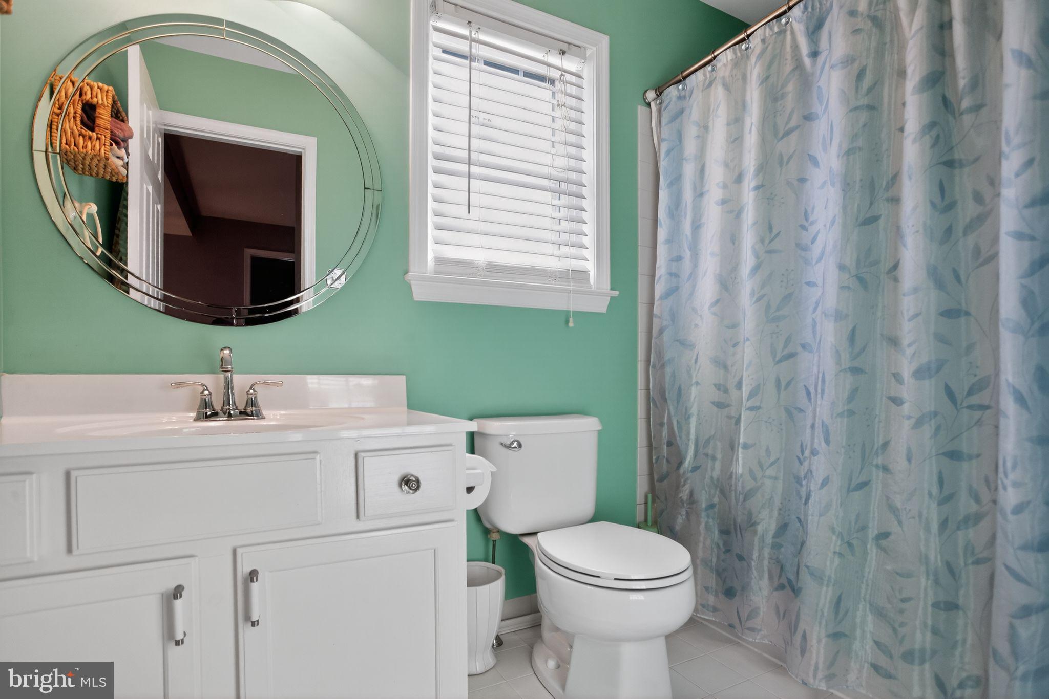 201 Victoria Court Ambler, PA 19002 - Photo 24 of 36 a bathroom with a toilet sink and mirror