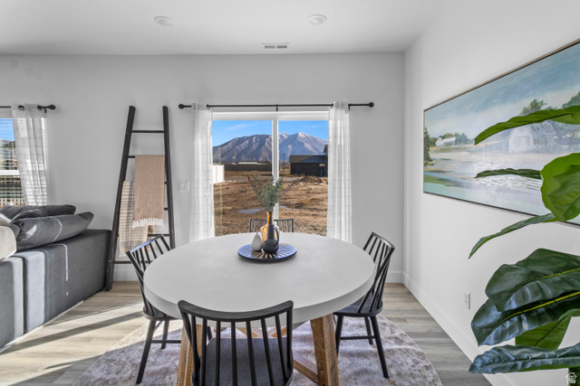 1264 West 500 South, Unit 320 Logan, UT 84321 - Photo 7 of 39 Dining area featuring a sliding glass door providing natural light and mountain scenery