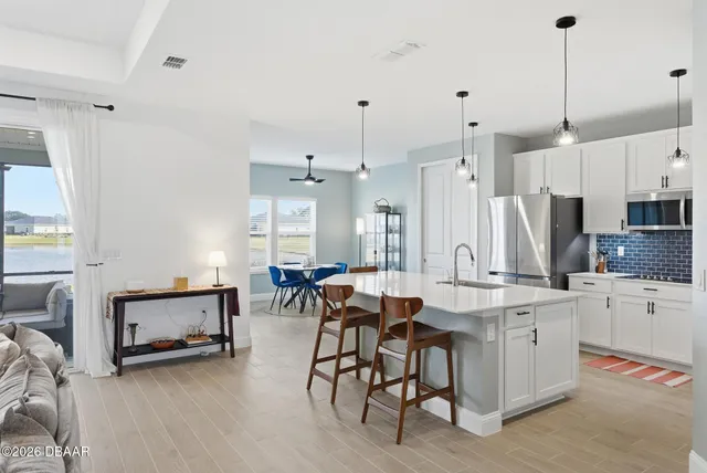 a kitchen with a sink and a stove