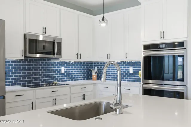 a bathroom with a double vanity sink and mirror