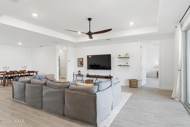 a bedroom with a bed and mirror