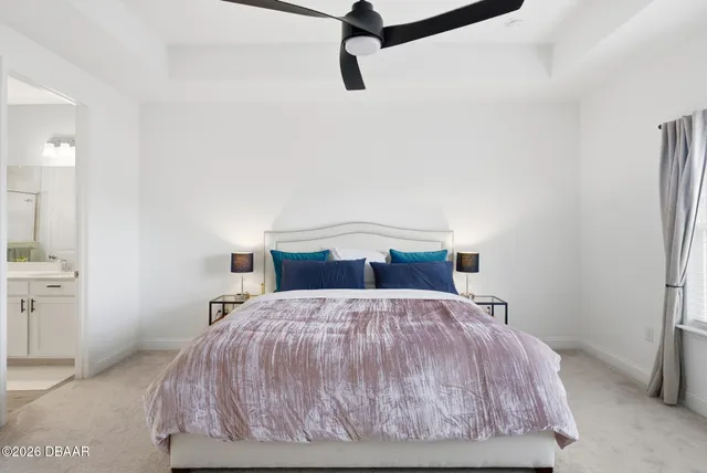 a view of a house with a big yard and potted plants