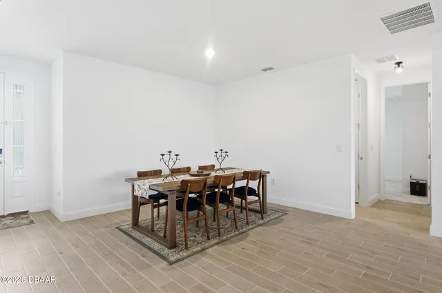 a view of a lake with houses in the back