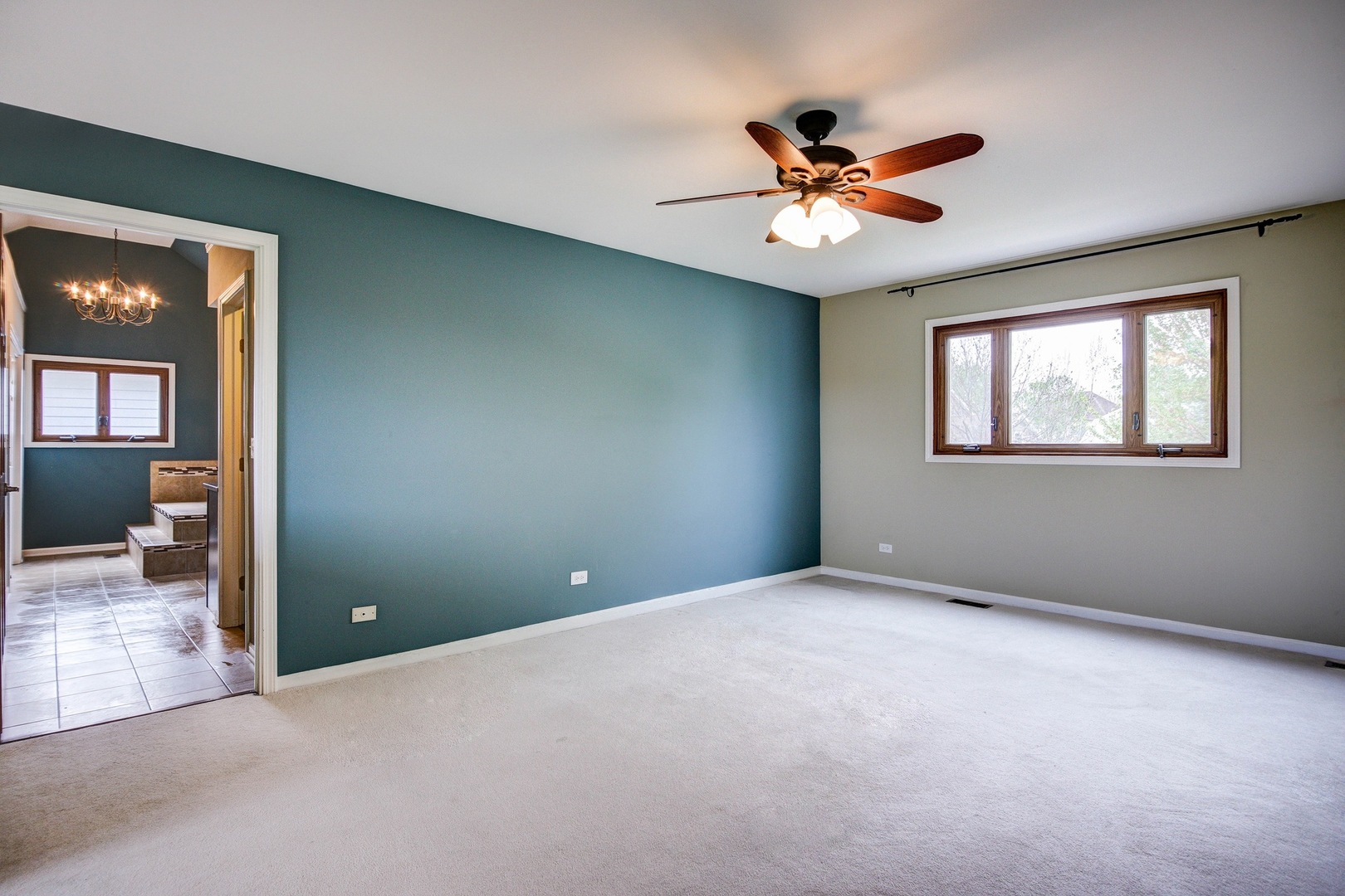 1945 Slippery Rock Road Naperville, IL 60565 - Photo 13 of 35 an empty room that has a window and a ceiling fan