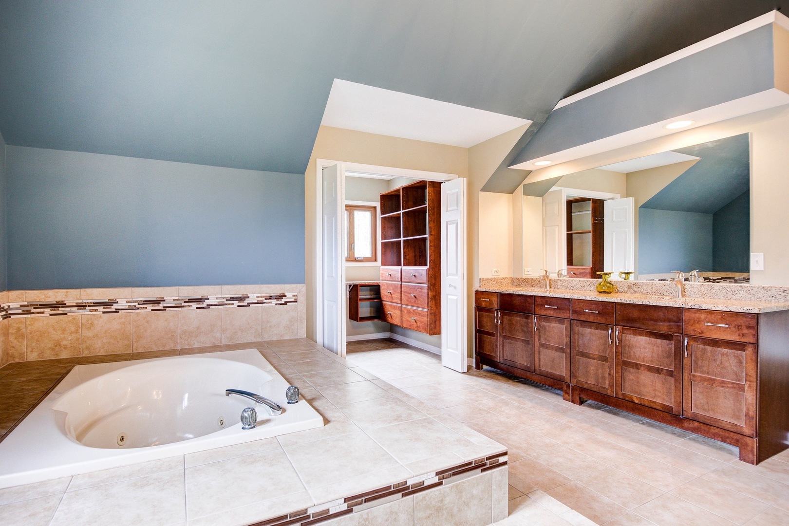 1945 Slippery Rock Road Naperville, IL 60565 - Photo 16 of 35 a bathroom with a tub sink and mirror