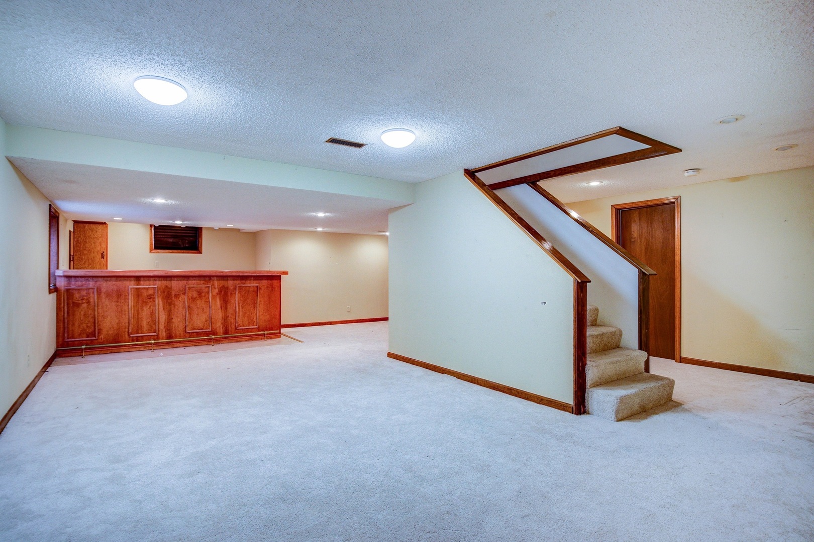 1945 Slippery Rock Road Naperville, IL 60565 - Photo 25 of 35 a view of an empty room with stairs and a window