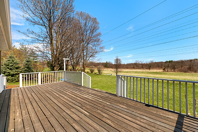 1945 Slippery Rock Road Naperville, IL 60565 - Photo 30 of 35 a view of balcony with wooden floor and fence