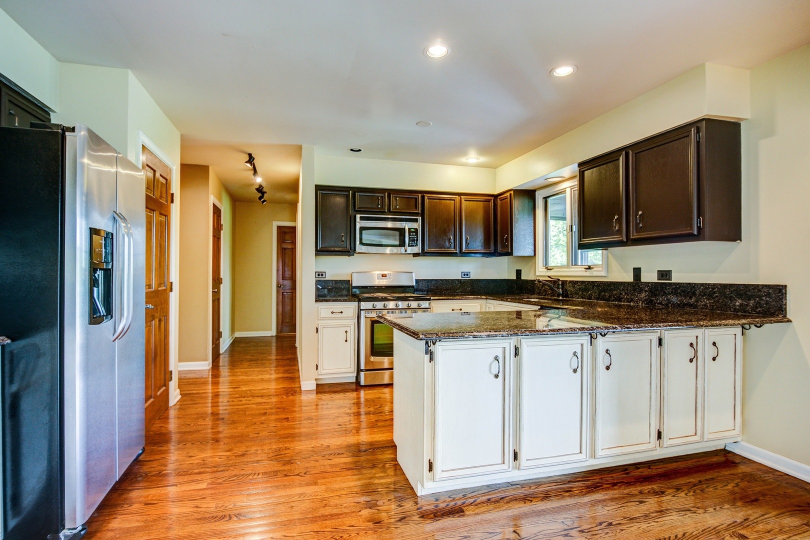 1945 Slippery Rock Road Naperville, IL 60565 - Photo 7 of 35 a kitchen with stainless steel appliances granite countertop a refrigerator and a stove top oven