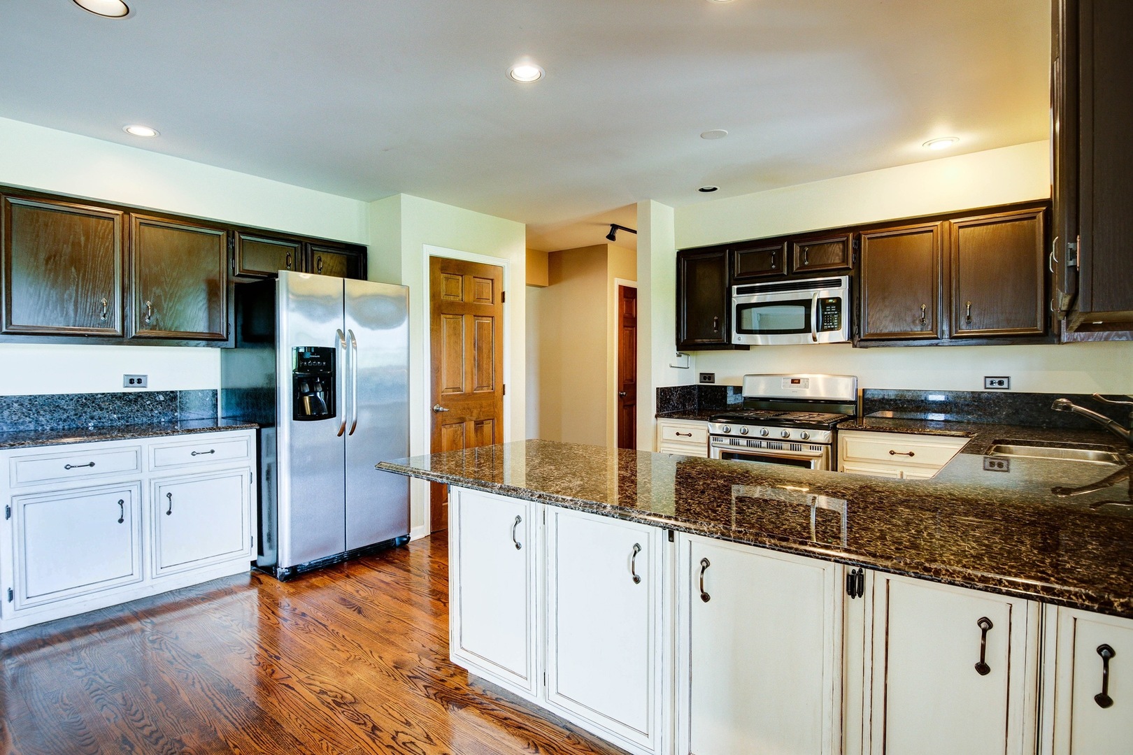 1945 Slippery Rock Road Naperville, IL 60565 - Photo 8 of 35 a kitchen with granite countertop a refrigerator and a sink