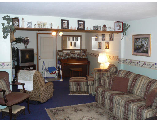 96 Sierra Vista Road Springfield, MA 01128 - Photo 2 of 2 a living room with furniture and a fireplace