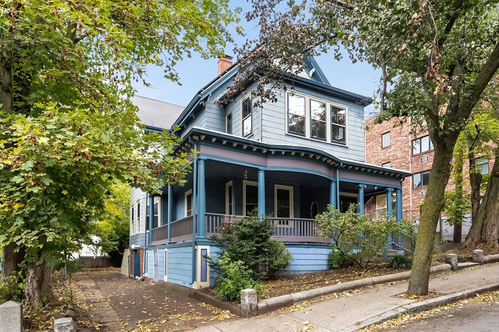 30 Walnut Street Somerville, MA 02143 - Photo 1 of 4 a front view of a house with garden