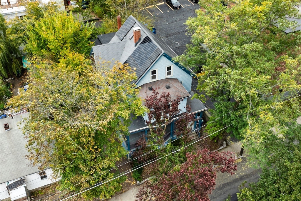 30 Walnut Street Somerville, MA 02143 - Photo 4 of 4 an aerial view of a house with a yard