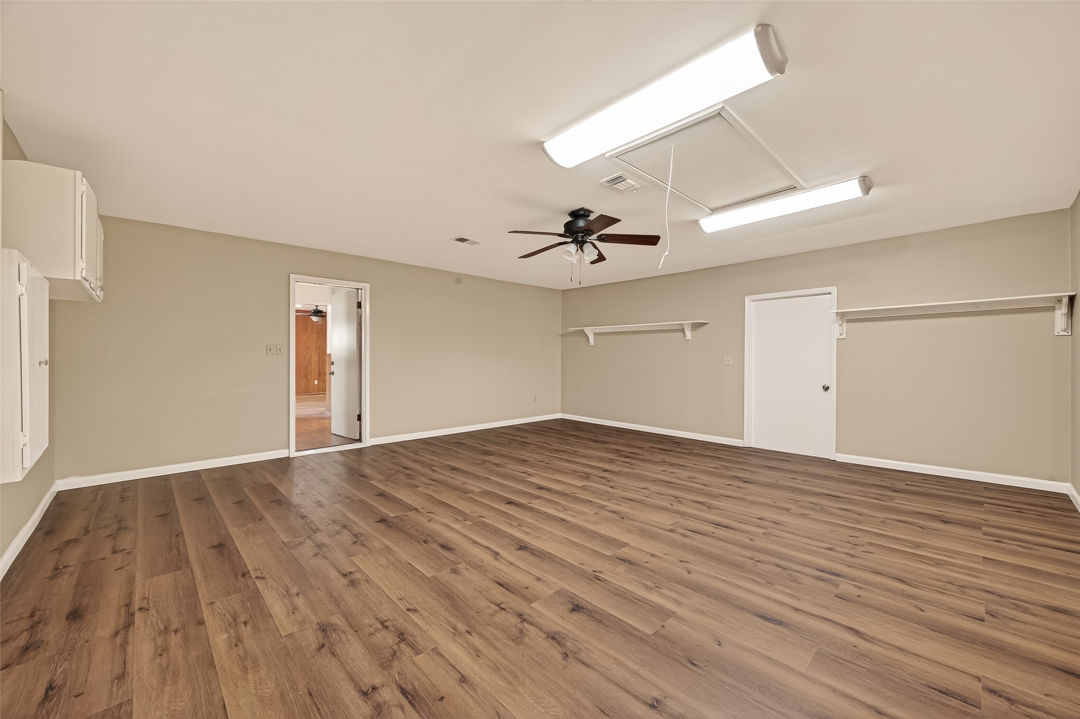 5646 Hazen Street Houston, TX 77081 - Photo 36 of 43 This massive flex space has brand-new vinyl flooring, bright overhead lighting, and new ceiling fixtures