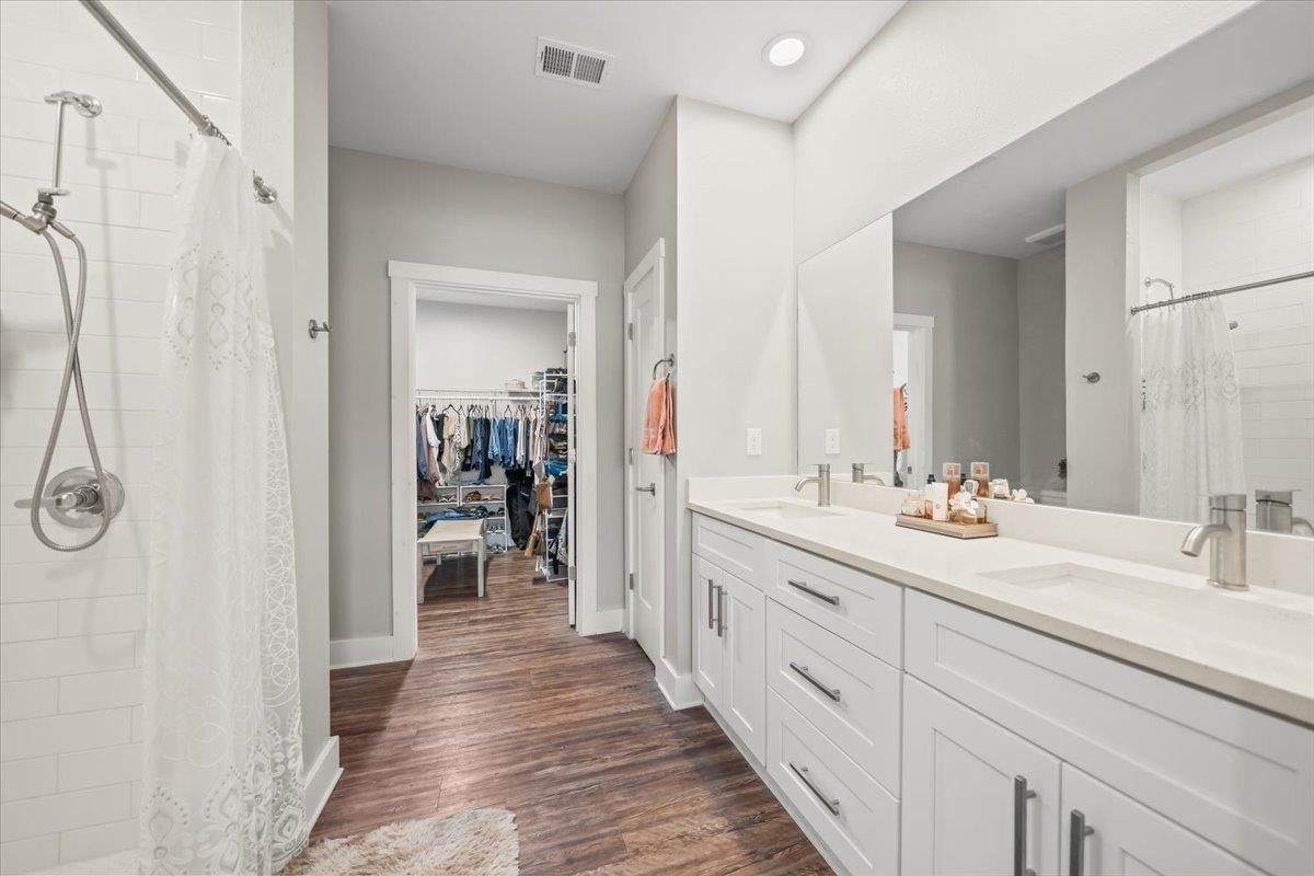 415 Abbey Road, Unit D Munford, TN 38058 - Photo 20 of 35 Bathroom featuring a dual vanity with white cabinetry, light-colored countertops, and brushed nickel fixtures