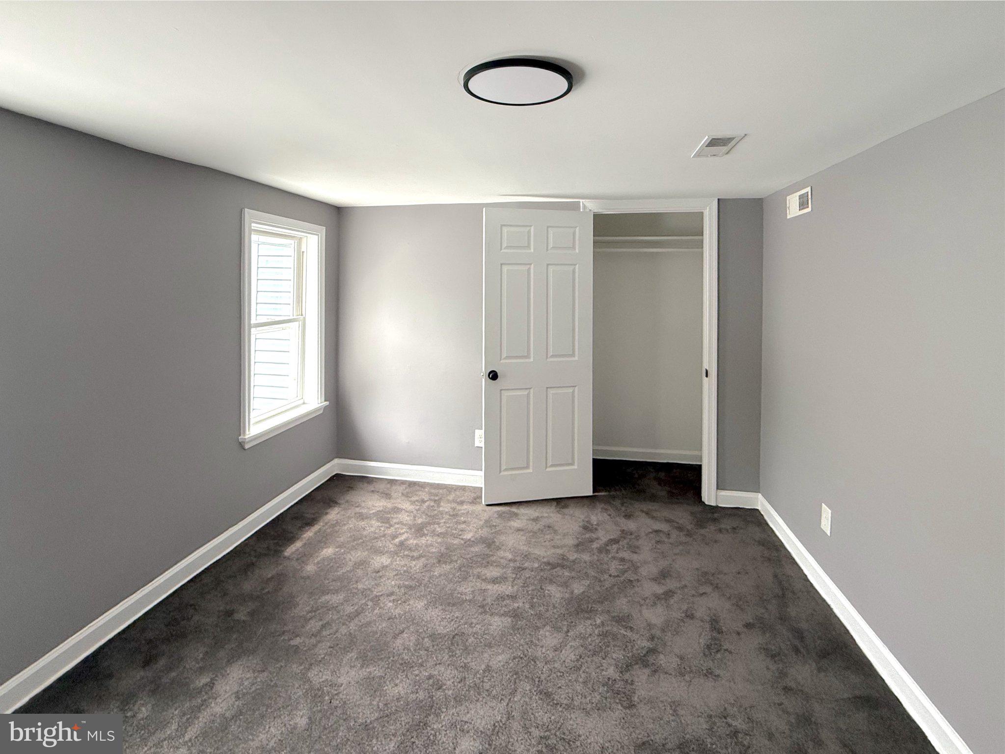 3703 6th Street, Unit 2 Baltimore, MD 21225 - Photo 10 of 20 Bright and airy gray bedroom retreat.