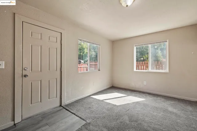 an empty room with windows