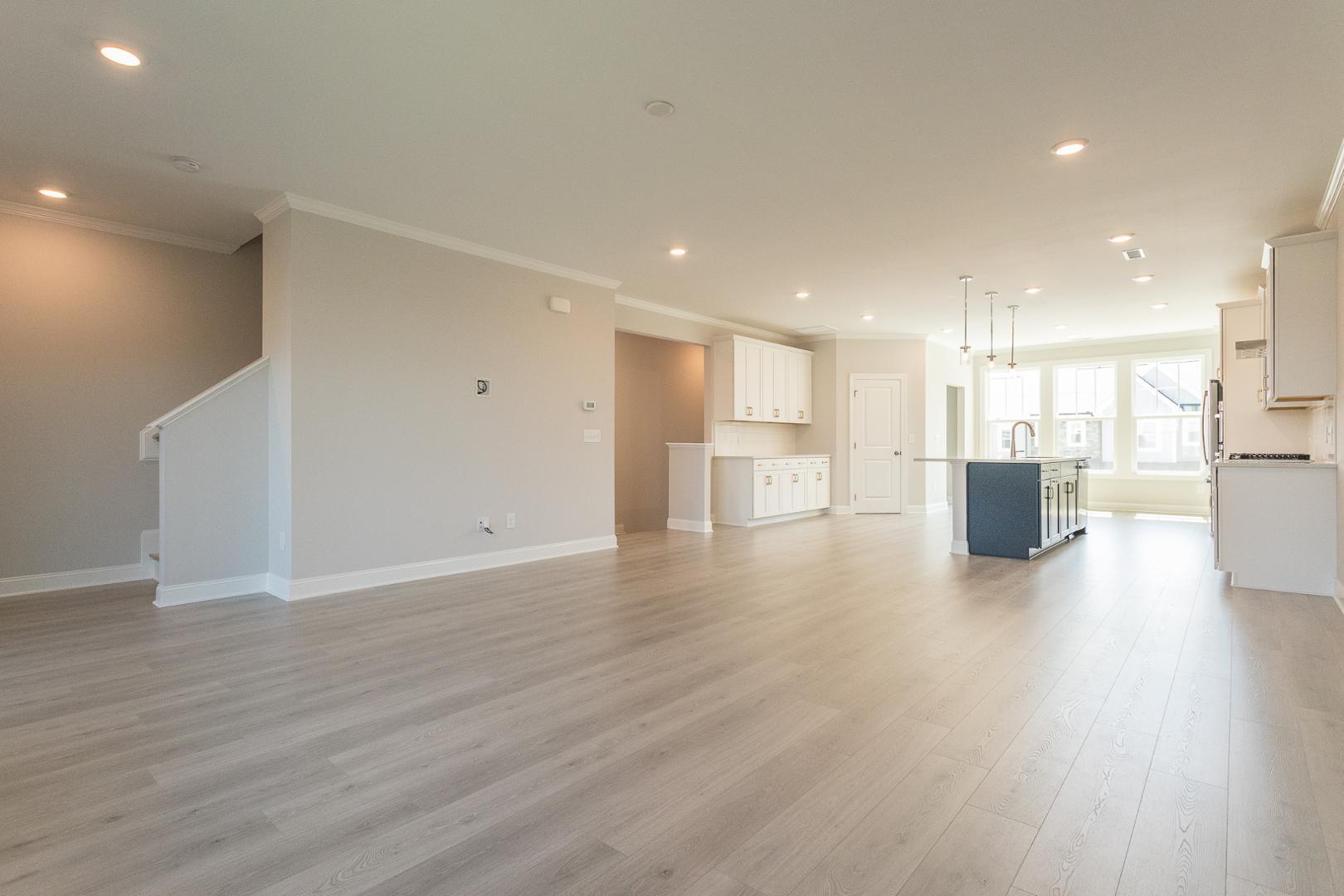 8421 Zinc Autumn Path Raleigh, NC 27615 - Photo 13 of 33 a view of a kitchen with a refrigerator and a stove top oven