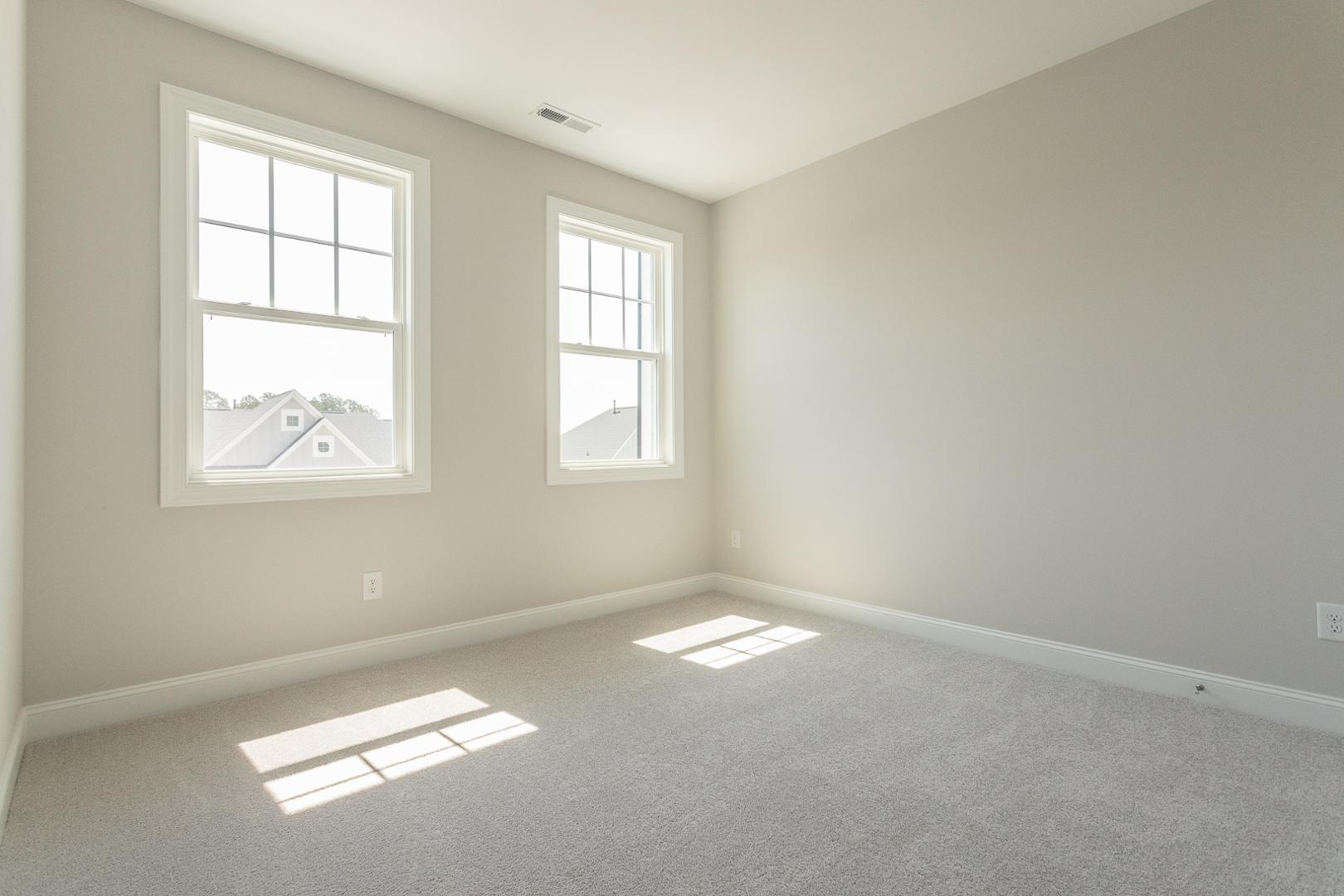 8421 Zinc Autumn Path Raleigh, NC 27615 - Photo 20 of 33 an empty room with windows