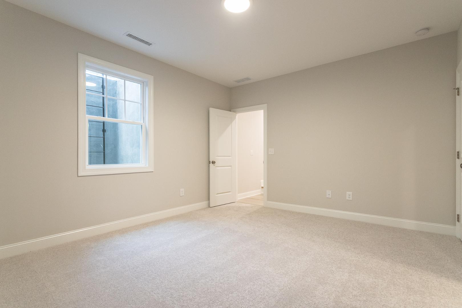 8421 Zinc Autumn Path Raleigh, NC 27615 - Photo 21 of 33 an empty room with windows and closet