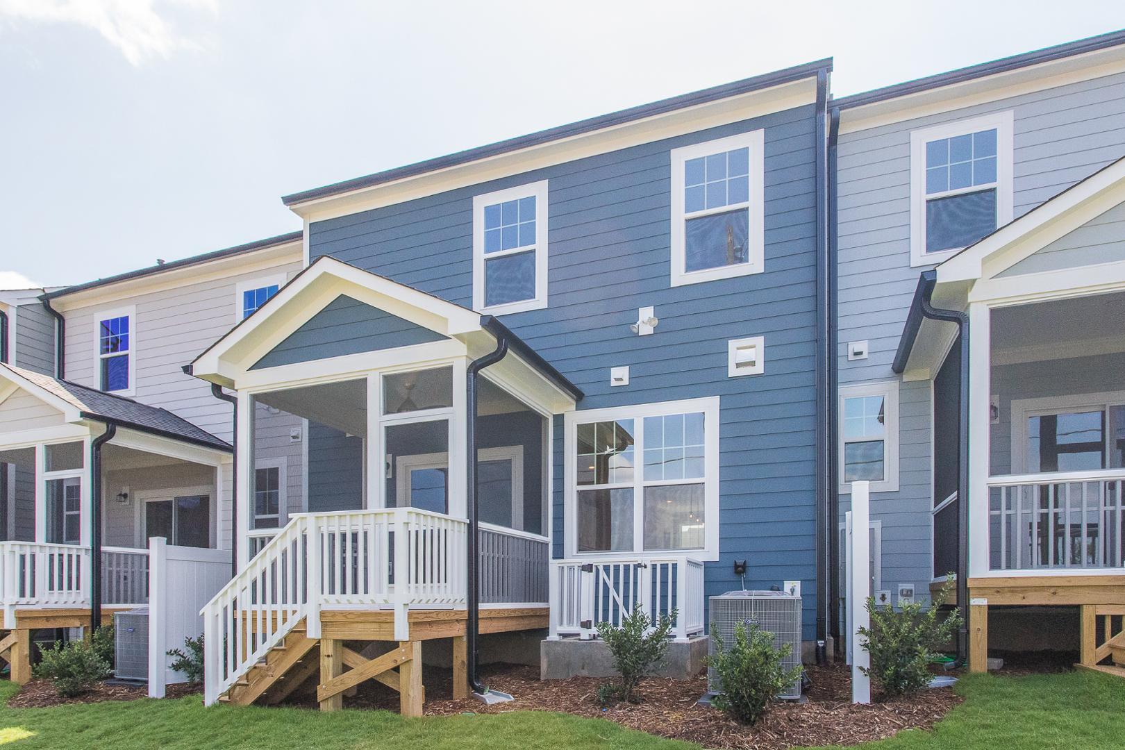 8421 Zinc Autumn Path Raleigh, NC 27615 - Photo 5 of 33 a view of a brick house with many windows and yard