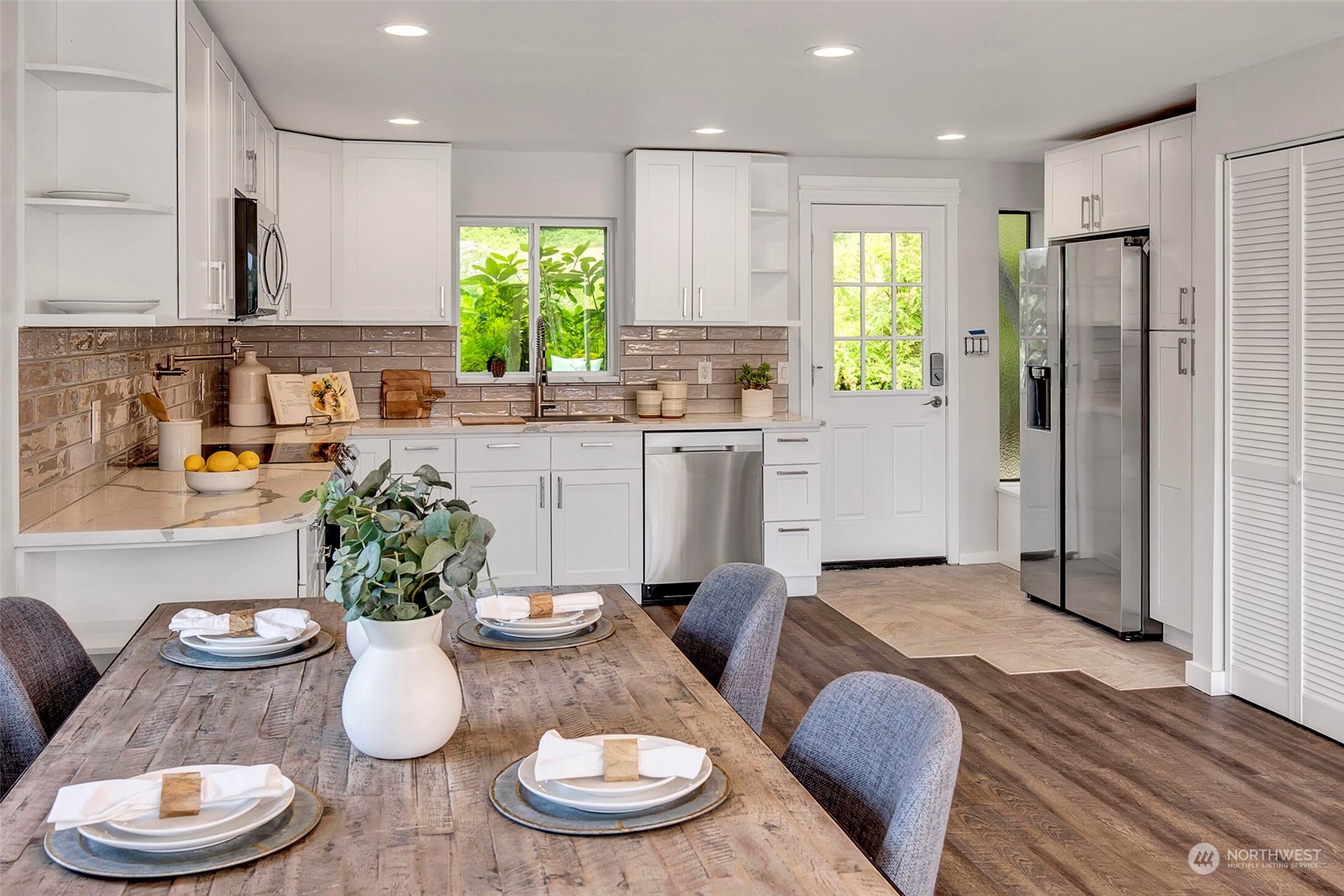 29316 Lake Chaplain Road Monroe, WA 98272 - Photo 6 of 18 a kitchen with a table and chairs in it
