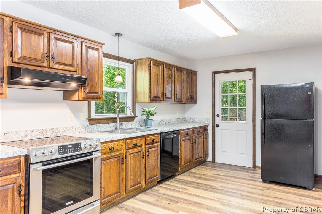 10060 Figg Shop Road Gloucester, VA 23061 - Photo 15 of 38 A new fridge too! Look at those views to the wooded back yard.