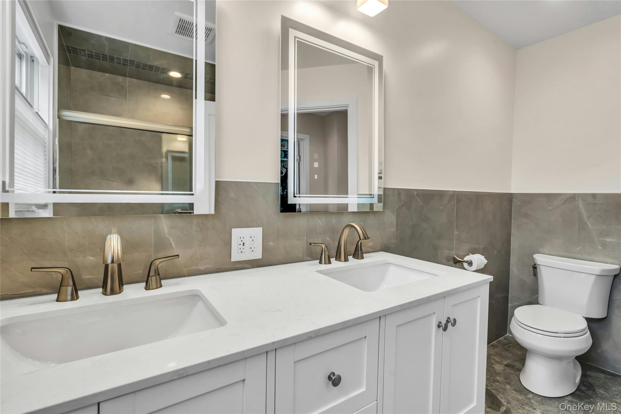 20 Robert Road Glen Cove, NY 11542 - Photo 14 of 24 a bathroom with a sink and a toilet