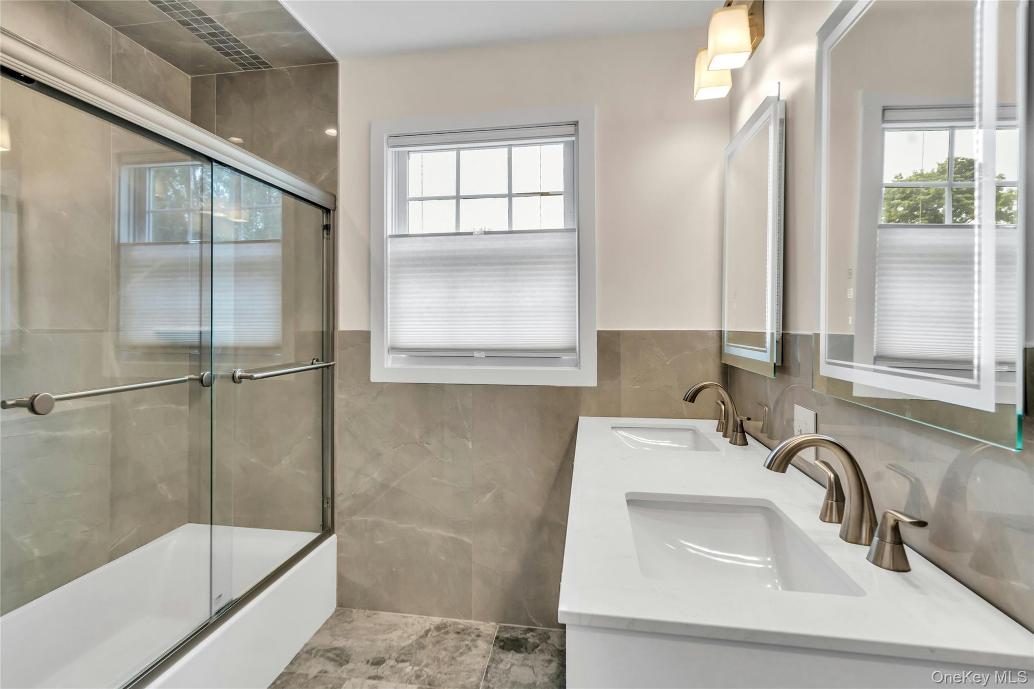 20 Robert Road Glen Cove, NY 11542 - Photo 16 of 24 a bathroom with a sink and a mirror