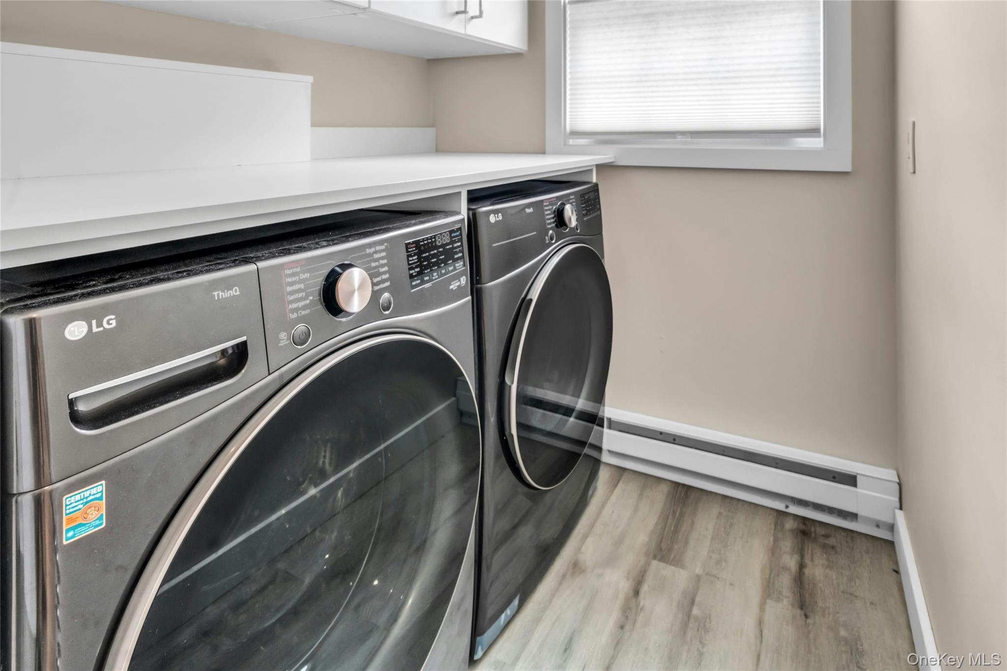 20 Robert Road Glen Cove, NY 11542 - Photo 17 of 24 a utility room with dryer and washer