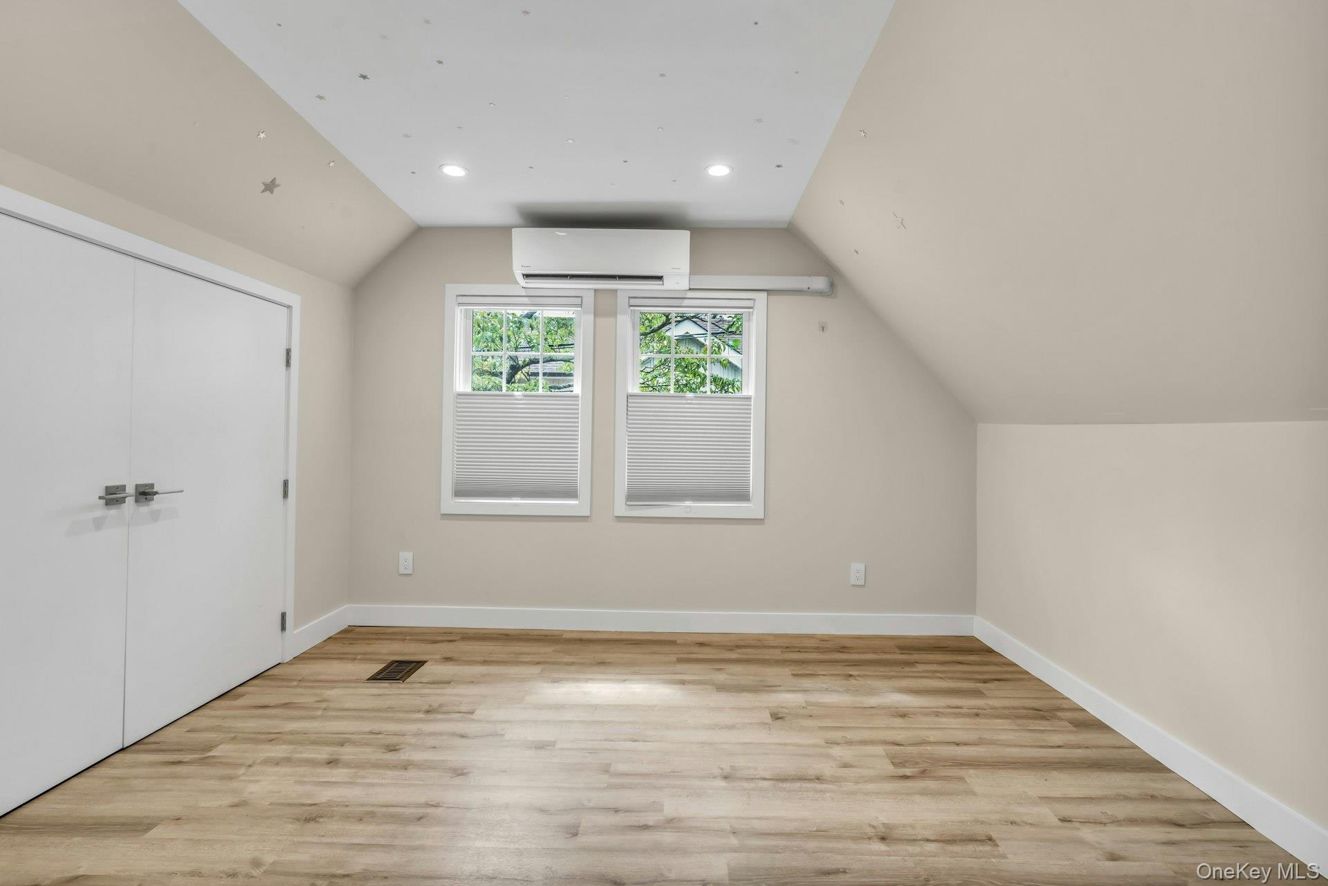 20 Robert Road Glen Cove, NY 11542 - Photo 19 of 24 wooden floor in an empty room with a window