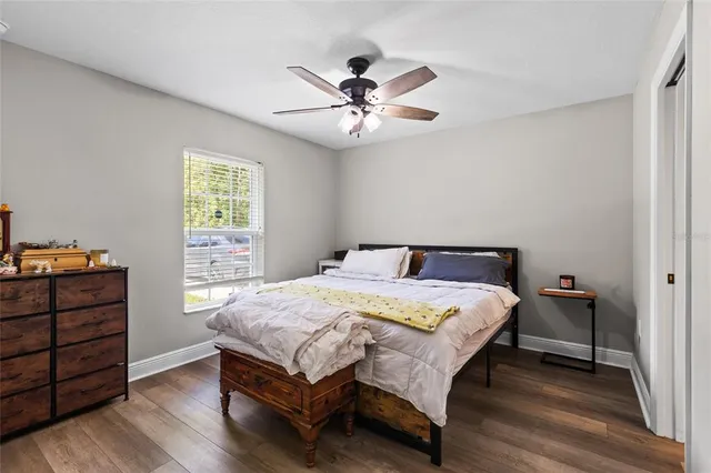 a bedroom with a bed and a table