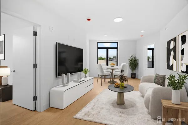 a living room with furniture and a flat screen tv